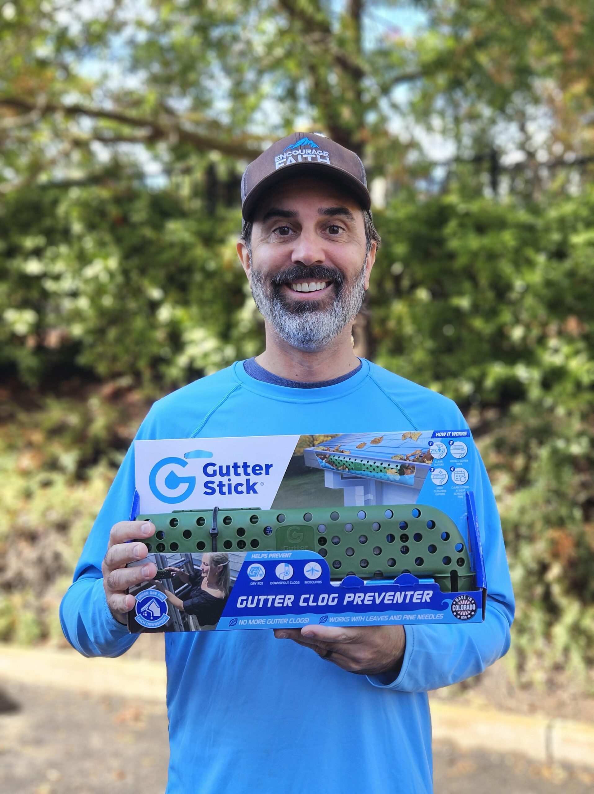 Darius holding a gutter stick.